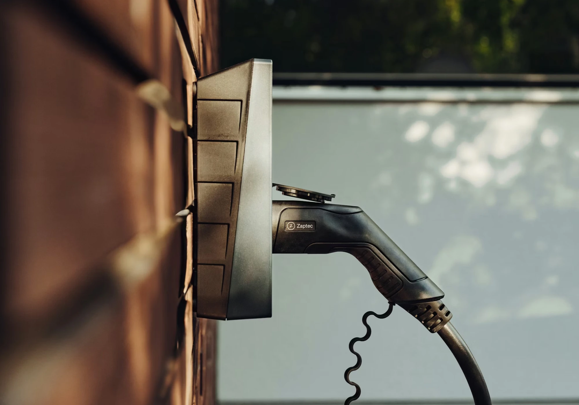 EV car charger plugged into a wall